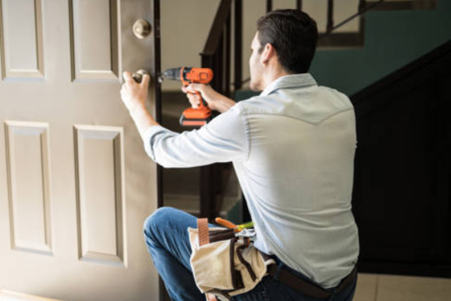 Handyman Changing Doorknob